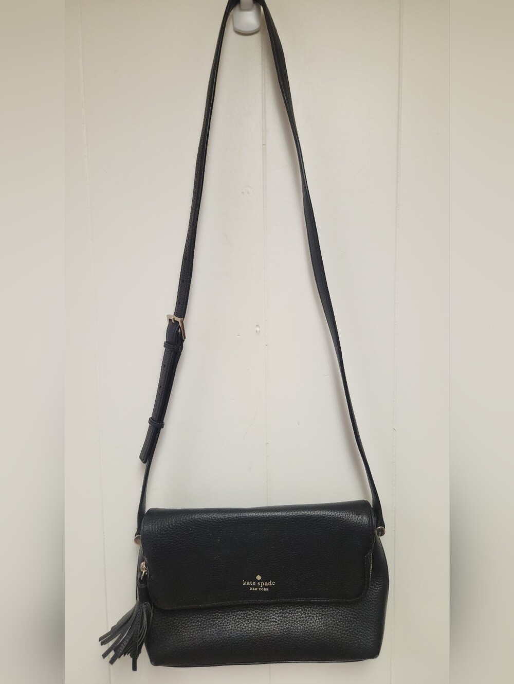 Kate Spade Classic Black pebbled leather flap crossbody with tassel